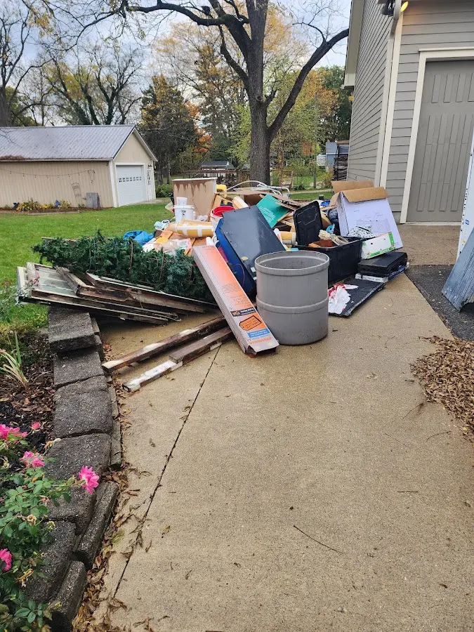 Dumpster being loaded with debris for Commercial Dumpster Rental in Schriever